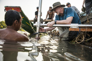 Fishermen bring in loads of fish from the Tonle Sap River in Cambodia